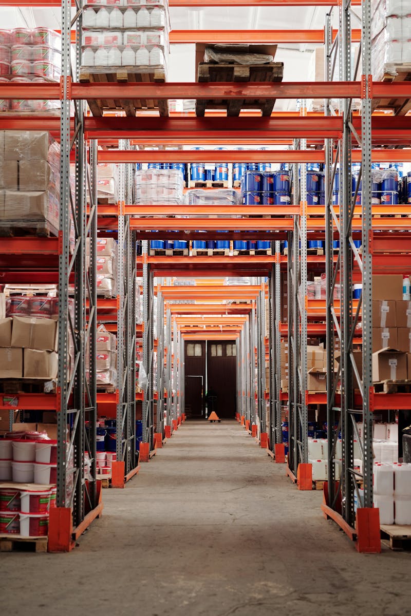 Warehouse aisle with standing pallet racking loaded with inventory